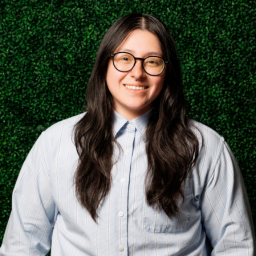 Los Cien's Communications Coordinator, Quetzali Topete. She is smiling.